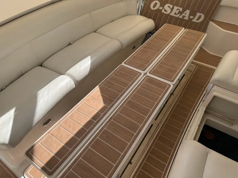 Slide: The Image of 2000 Tiara Yachts 4000 Express interior with beige seating and wooden flooring. - 36