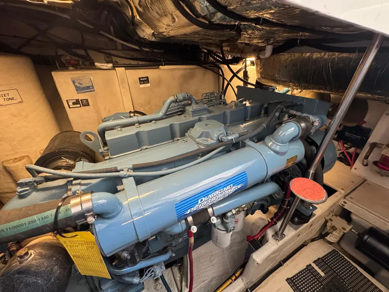 Slide: The Image of Engine room of a 2000 Tiara Yachts 4000 Express, featuring a diesel engine. - 37