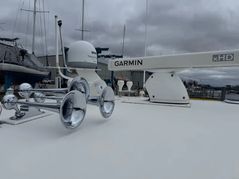 Slide: The Image of Tiara Yachts 4000 Express 2000 model with Garmin radar and chrome horns on deck. - 48