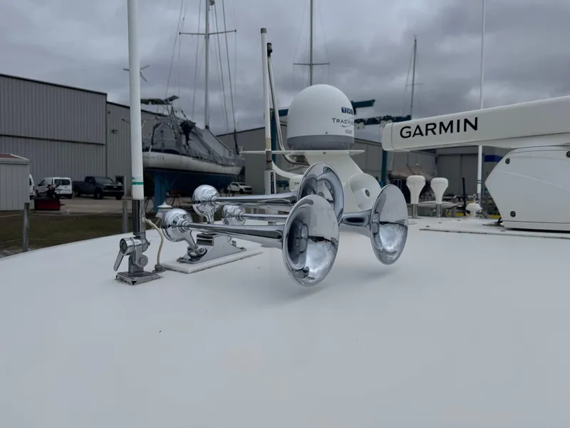 Slide: The Image of Tiara Yachts 4000 Express 2000 with radar and horn on deck, overcast sky. - 49