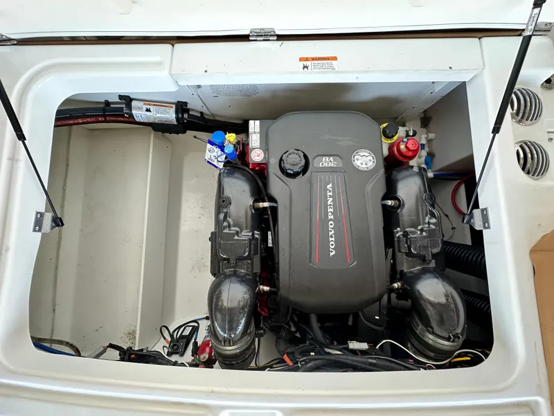Slide: The Image of Engine compartment of 2023 Four Winns HD8 boat featuring Volvo Penta engine. - 12
