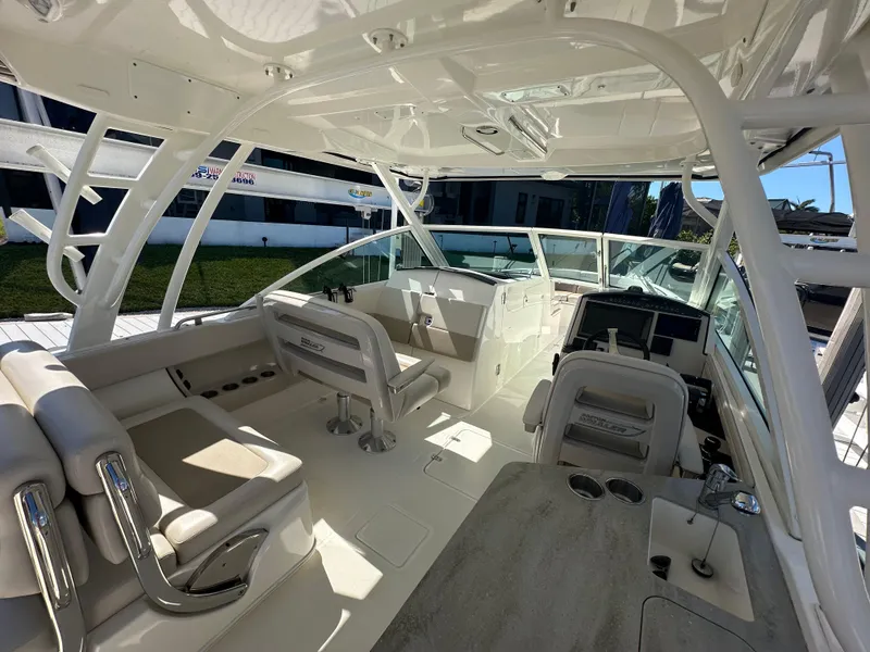 Slide: The Image of 2018 Boston Whaler 320 Vantage interior with seating and sink. - 18