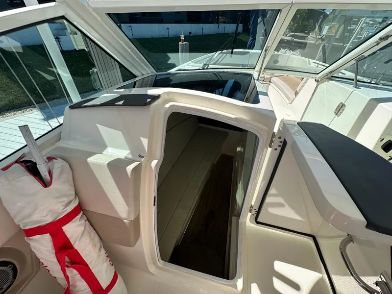 Slide: The Image of 2018 Boston Whaler 320 Vantage interior with control panel and sink. - 20