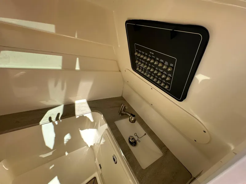 Slide: The Image of 2018 Boston Whaler 320 Vantage boat interior with helm seat and steering wheel. - 25