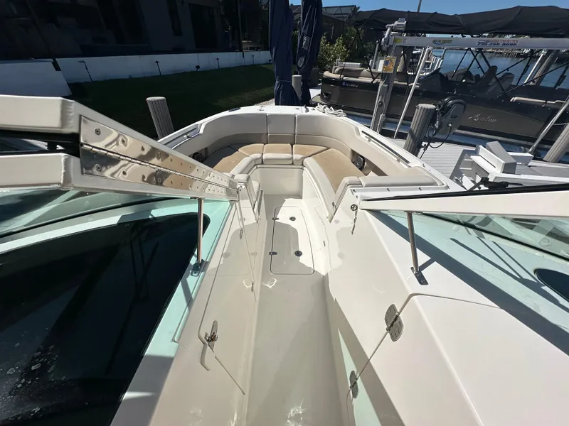 Slide: The Image of 2018 Boston Whaler 320 Vantage boat interior with sleek countertop and storage. - 26