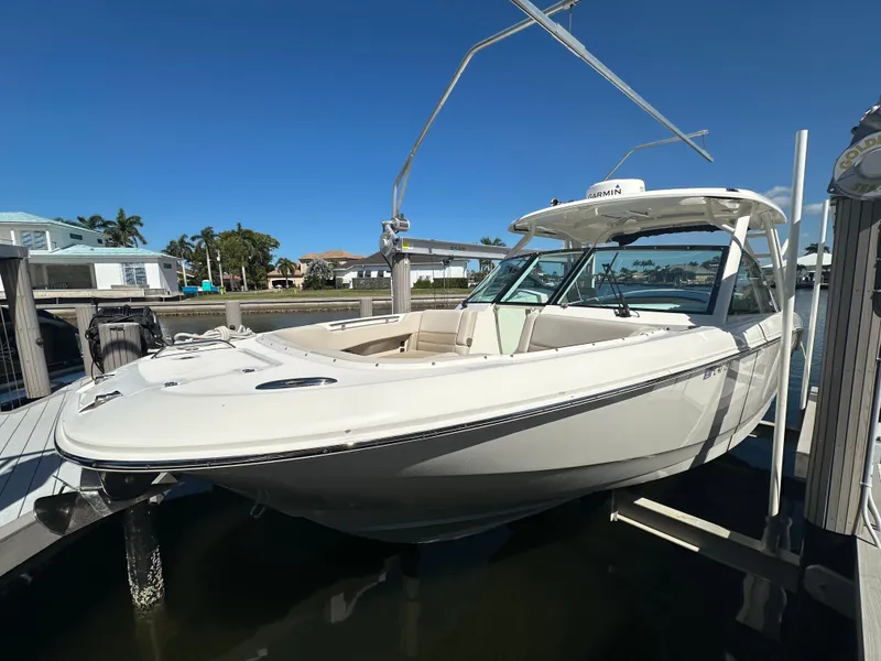 Slide: The Image of 2018 Boston Whaler 320 Vantage boat docked under clear blue sky. - 3