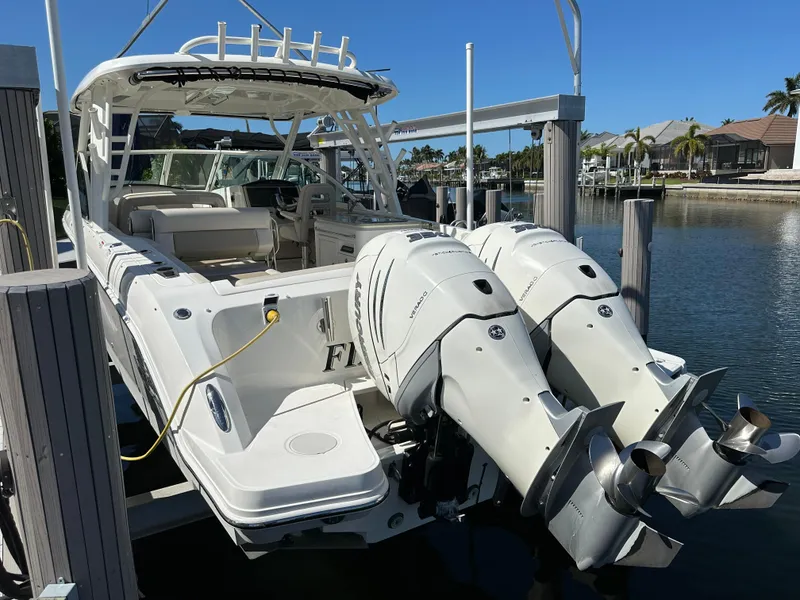 Slide: The Image of 2018 Boston Whaler 320 Vantage boat interior with seating and helm station. - 7