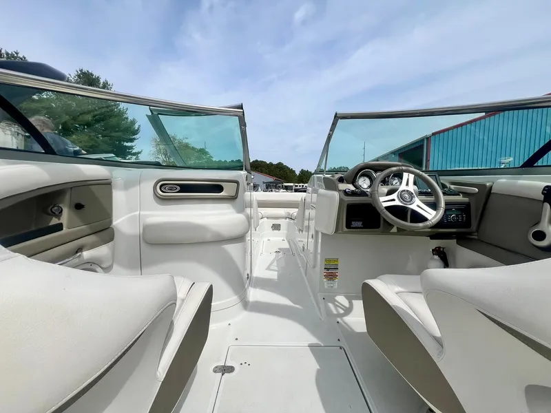 Slide: The Image of 2016 Crownline Eclipse E4 XS boat interior with steering wheel and seating. - 12