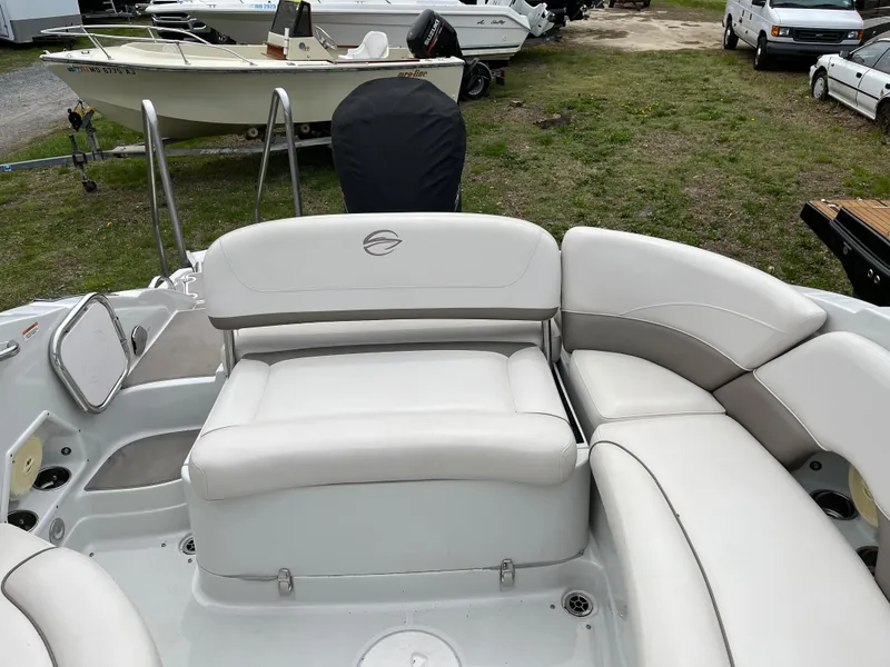 Slide: The Image of 2016 Crownline Eclipse E4 XS boat interior with white seating and spacious layout. - 15