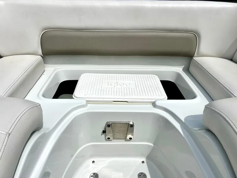 Slide: The Image of 2016 Crownline Eclipse E4 XS boat interior with seating and storage compartment. - 23