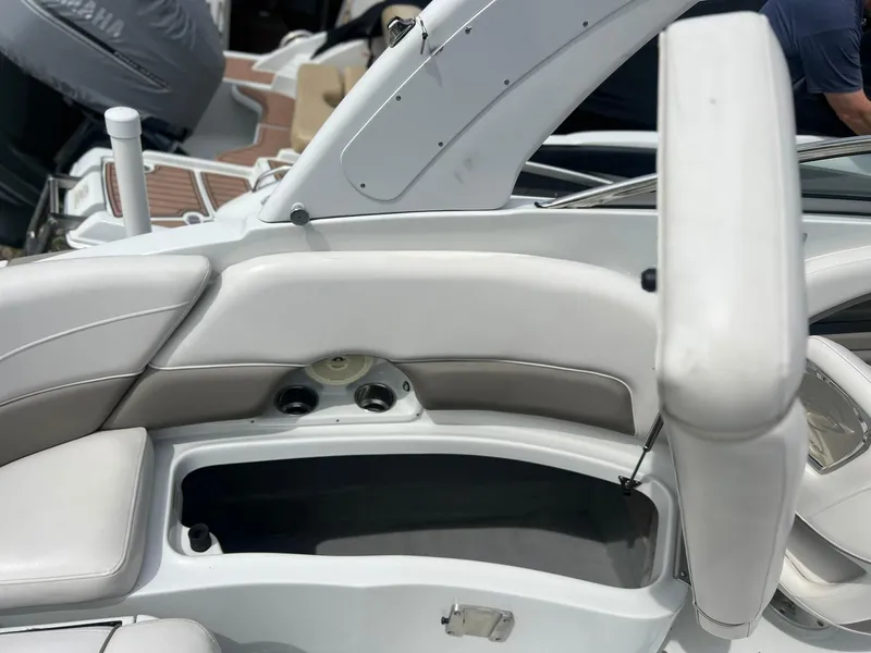 Slide: The Image of 2016 Crownline Eclipse E4 XS boat interior with white seating and storage compartment. - 29