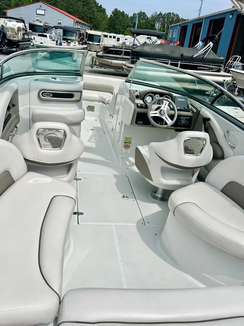 Slide: The Image of 2016 Crownline Eclipse E4 XS boat interior with white seating and steering console. - 30
