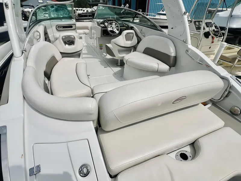 Slide: The Image of 2016 Crownline Eclipse E4 XS boat interior with white seating and modern dashboard. - 32