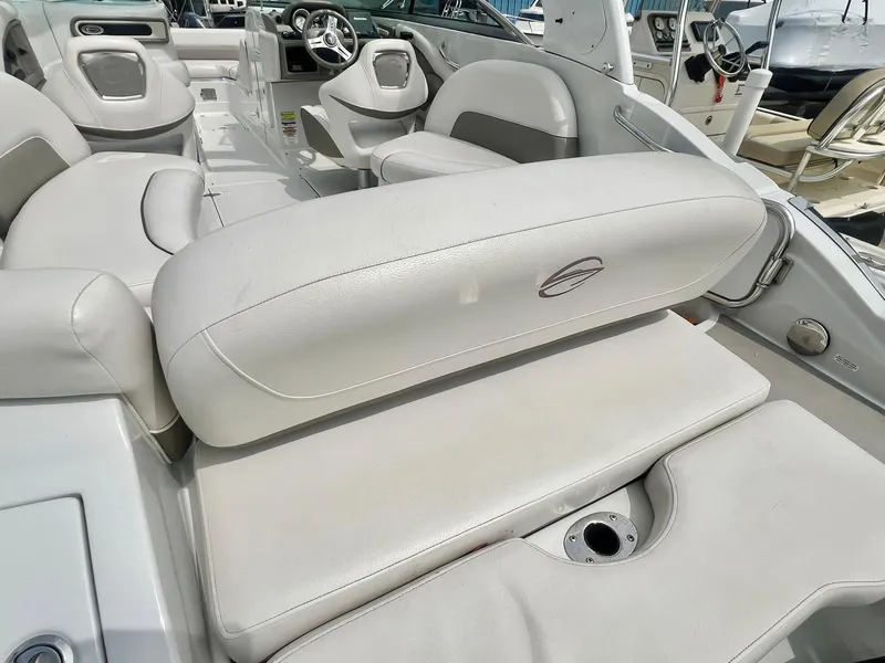 Slide: The Image of 2016 Crownline Eclipse E4 XS boat interior with white seating and steering wheel. - 33