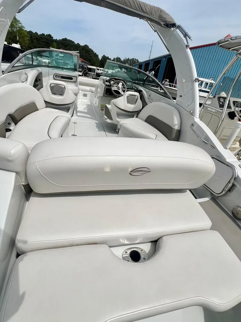 Slide: The Image of 2016 Crownline Eclipse E4 XS boat interior with white seating and steering wheel. - 35