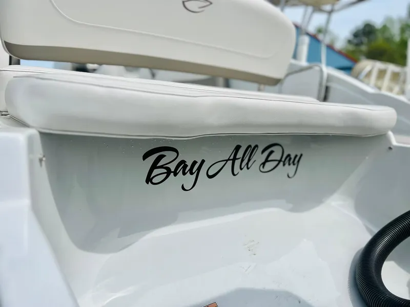 Slide: The Image of 2016 Crownline Eclipse E4 XS boat with "Bay All Day" text on the side. - 37
