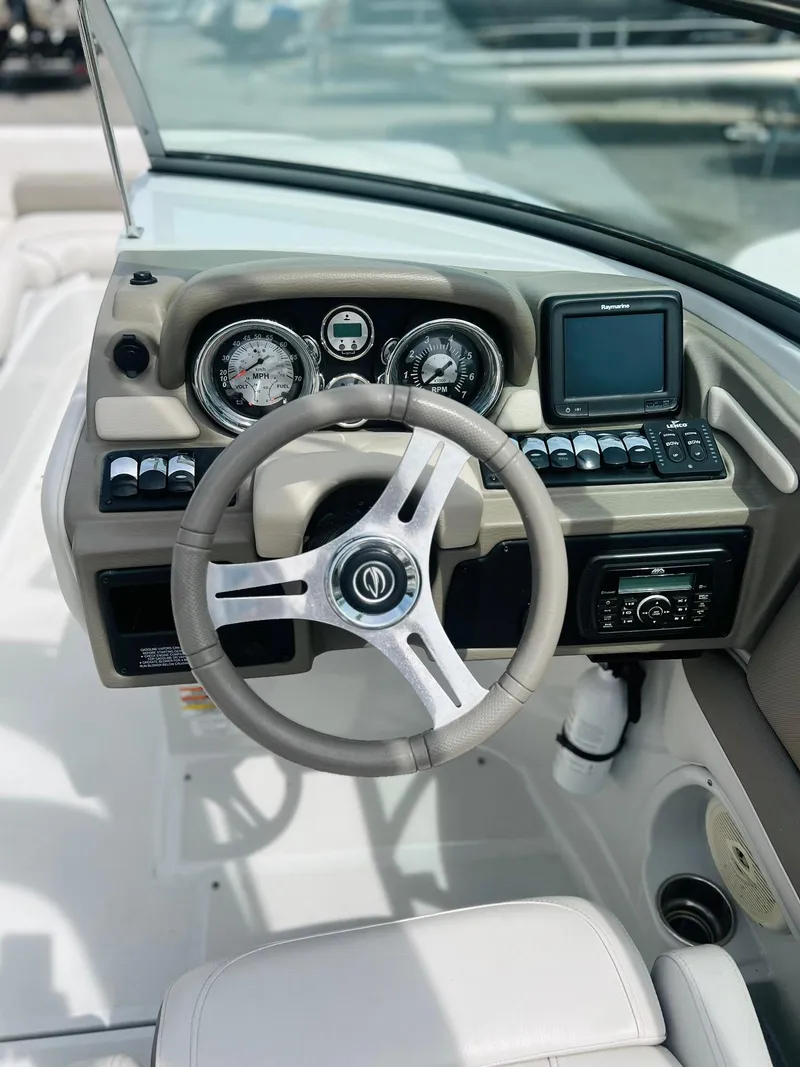 Slide: The Image of Steering console of 2016 Crownline Eclipse E4 XS boat with gauges and controls. - 8