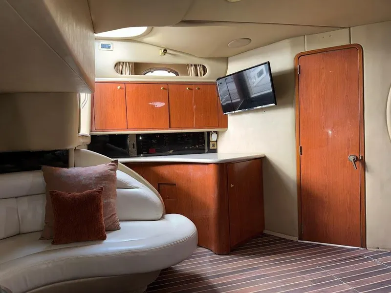 Slide: The Image of Interior of 1998 Sea Ray 500 Sundancer yacht with cozy seating and modern amenities. - 13
