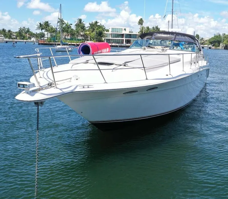 Slide: The Image of 1998 Sea Ray 500 Sundancer yacht anchored in a sunny marina. - 2