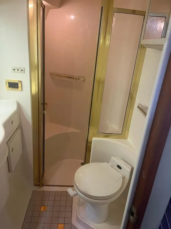 Slide: The Image of Bathroom interior of 1998 Sea Ray 500 Sundancer yacht with shower and toilet. - 24