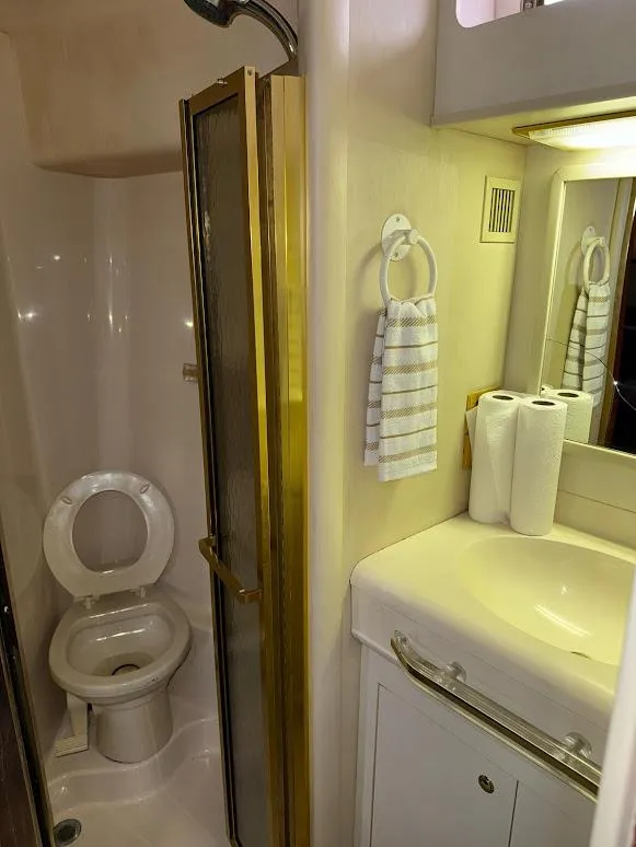 Slide: The Image of Bathroom interior of 1998 Sea Ray 500 Sundancer yacht with shower and sink. - 26