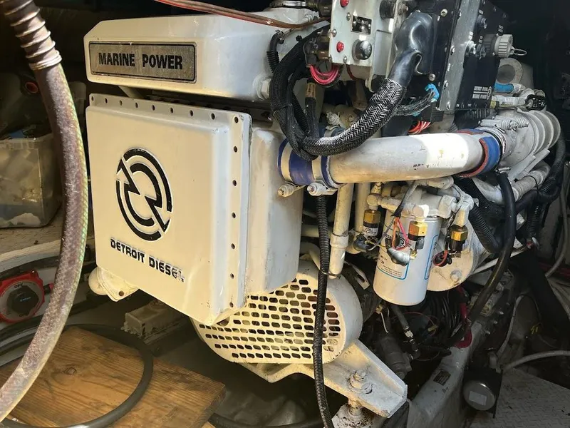 Slide: The Image of Engine of a 1998 Sea Ray 500 Sundancer with Detroit Diesel branding. - 27