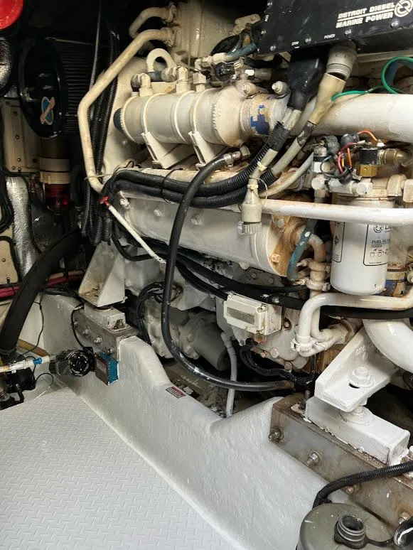 Slide: The Image of Engine compartment of a 1998 Sea Ray 500 Sundancer boat, showcasing mechanical components. - 30