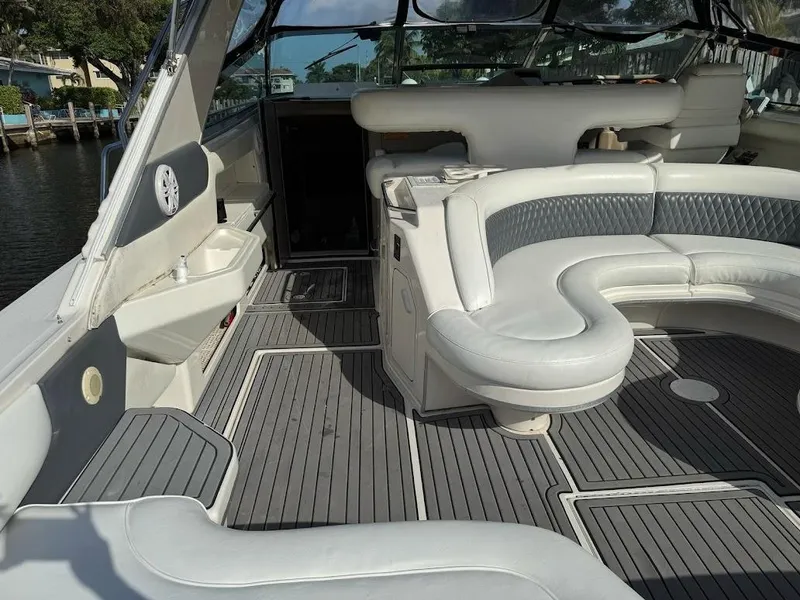 Slide: The Image of 1998 Sea Ray 500 Sundancer yacht interior with white leather seating and gray flooring. - 5