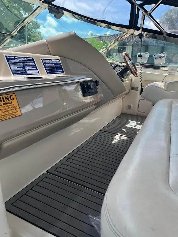 Slide: The Image of 1998 Sea Ray 500 Sundancer interior with leather seating and control panel. - 7