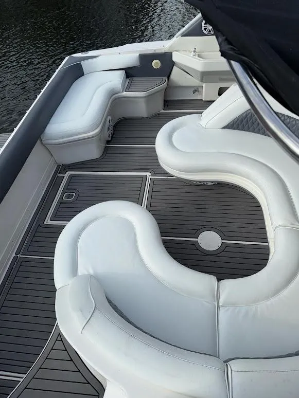 Slide: The Image of 1998 Sea Ray 500 Sundancer boat with sleek white seating and elegant deck design. - 8