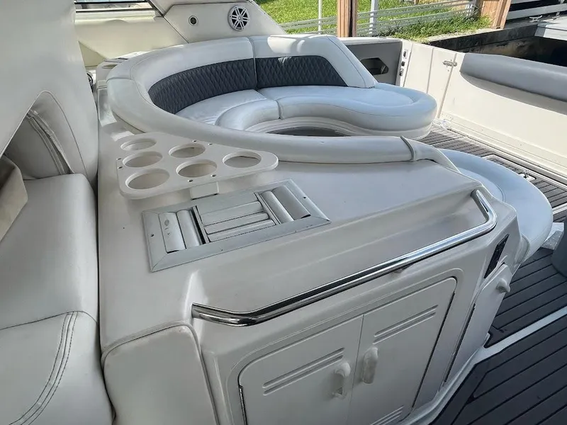 Slide: The Image of Luxurious seating area on a 1998 Sea Ray 500 Sundancer yacht with cup holders. - 9