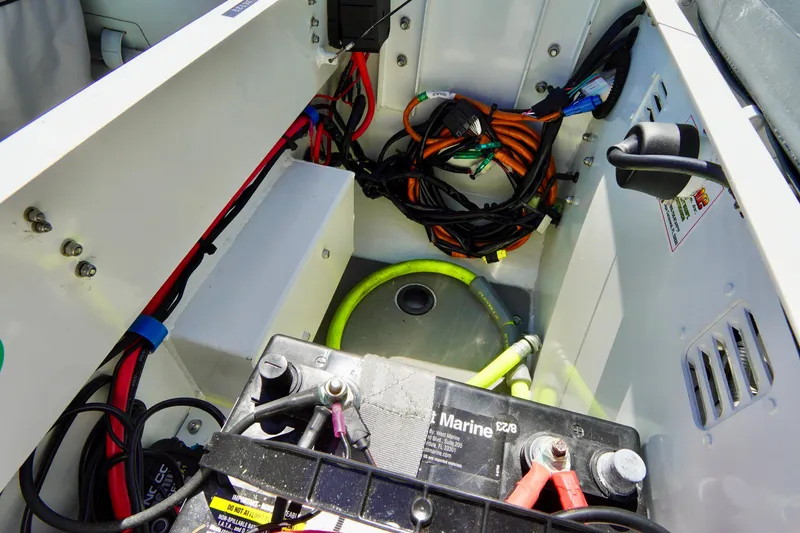 Slide: The Image of 2023 Highfield Classic 340 GT boat interior showing battery and wiring setup. - 14