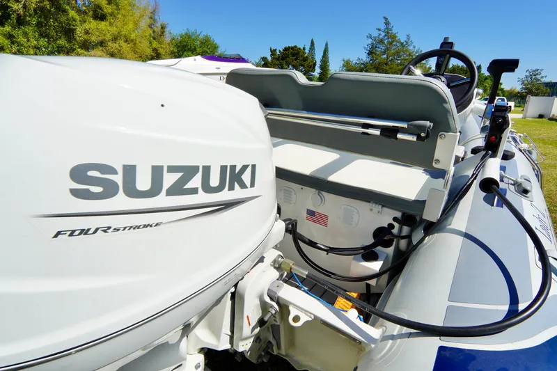 Slide: The Image of 2023 Highfield Classic 340 GT with Suzuki four-stroke engine, outdoor setting. - 17