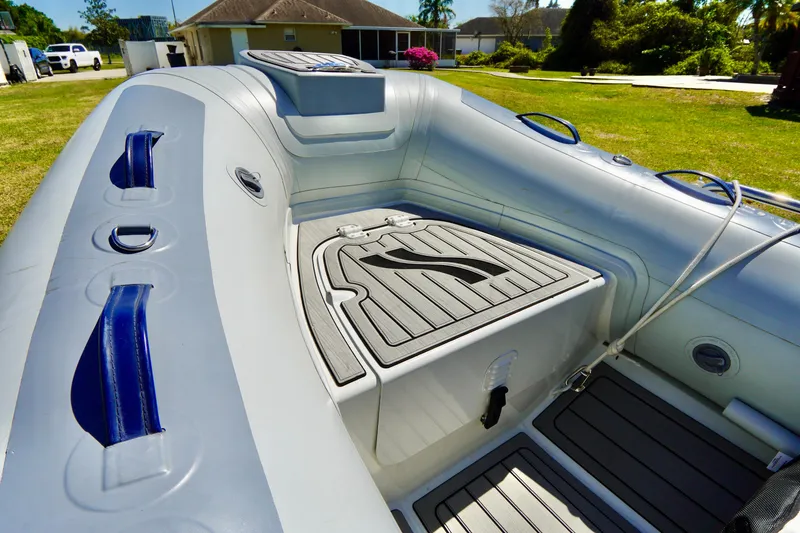 Slide: The Image of 2023 Highfield Classic 340 GT inflatable boat interior with seating and storage compartments. - 4