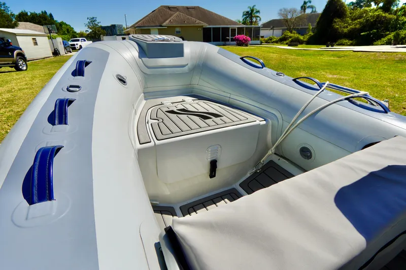 Slide: The Image of 2023 Highfield Classic 340 GT inflatable boat interior with seating and storage compartments. - 5