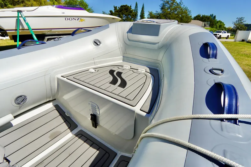 Slide: The Image of 2023 Highfield Classic 340 GT inflatable boat interior with seating and storage. - 6