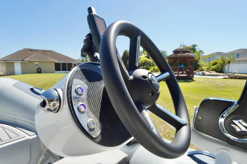 Slide: The Image of Steering wheel of 2023 Highfield Classic 340 GT boat, featuring modern controls and sleek design. - 9