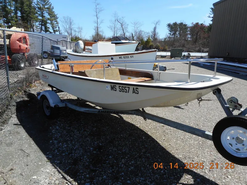 Slide: The Image of 1986 Boston Whaler 13 Super Sport boat on trailer, parked outdoors. - 3