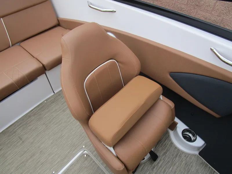 Slide: The Image of 2018 Glastron GT180 boat interior with tan seating and modern design. - 14