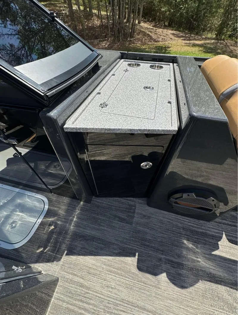 Slide: The Image of 2023 Crest Continental NX 270 boat interior with sleek design and modern amenities. - 17