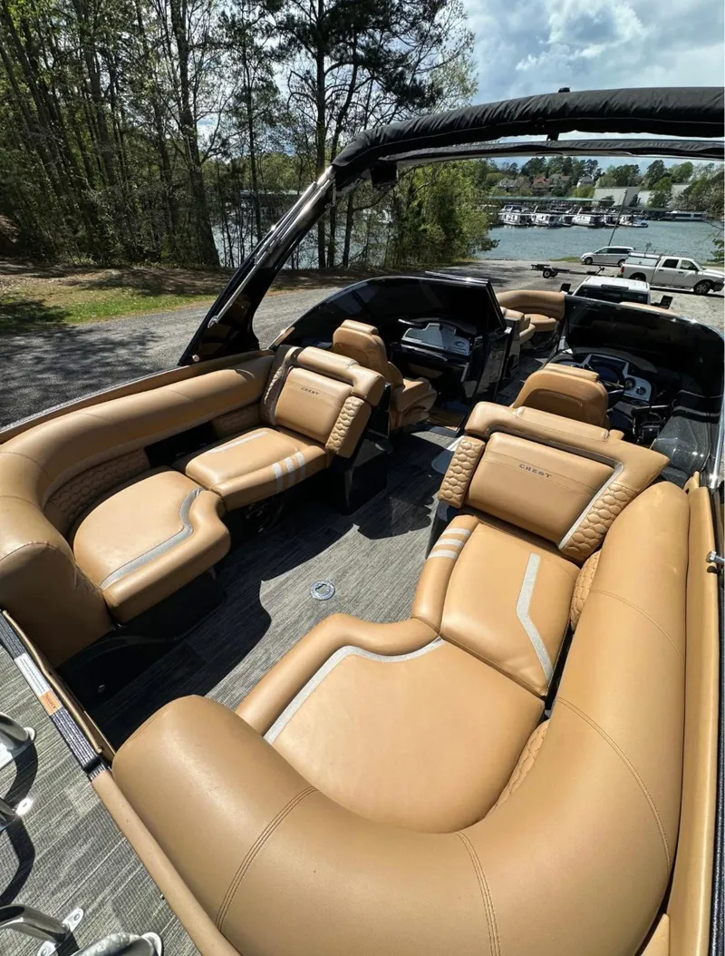 Slide: The Image of Luxurious 2023 Crest Continental NX 270 boat interior with plush tan seating. - 5