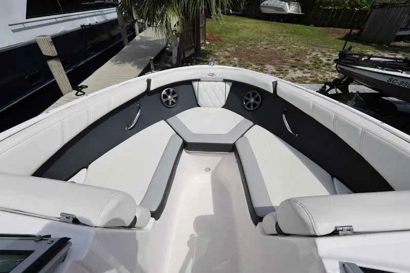 Slide: The Image of 2022 Regal 21 OBX boat interior with white seating and modern design. - 27