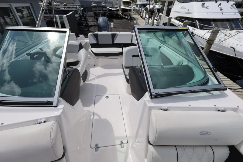 Slide: The Image of 2022 Regal 21 OBX boat interior with open bow seating and windshield. - 30