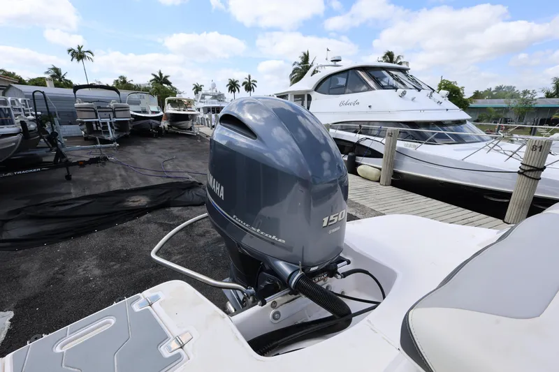 Slide: The Image of 2022 Regal 21 OBX boat with Yamaha 150 outboard motor at marina. - 39