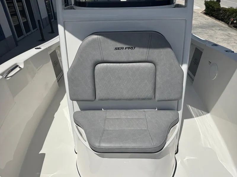 Slide: The Image of 2021 Sea Pro 239 Center Console boat seat with gray upholstery. - 11