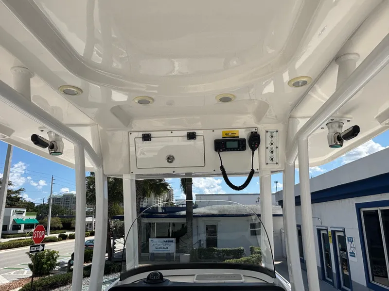 Slide: The Image of 2021 Sea Pro 239 Center Console boat interior with electronics and storage compartments. - 13