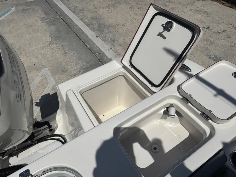 Slide: The Image of 2021 Sea Pro 239 Center Console boat with open storage compartments. - 7