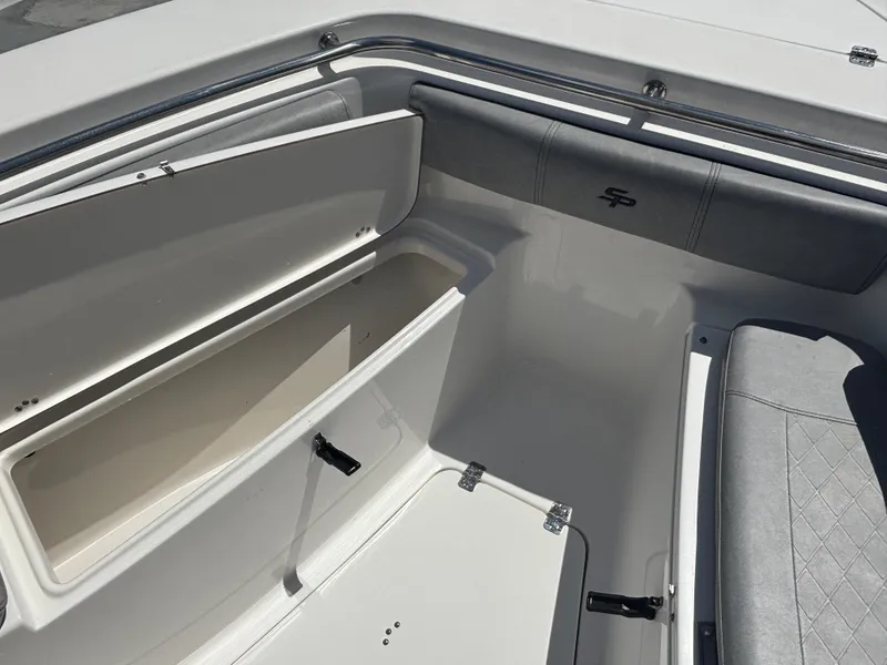 Slide: The Image of 2021 Sea Pro 239 Center Console boat storage compartments and seating area. - 9