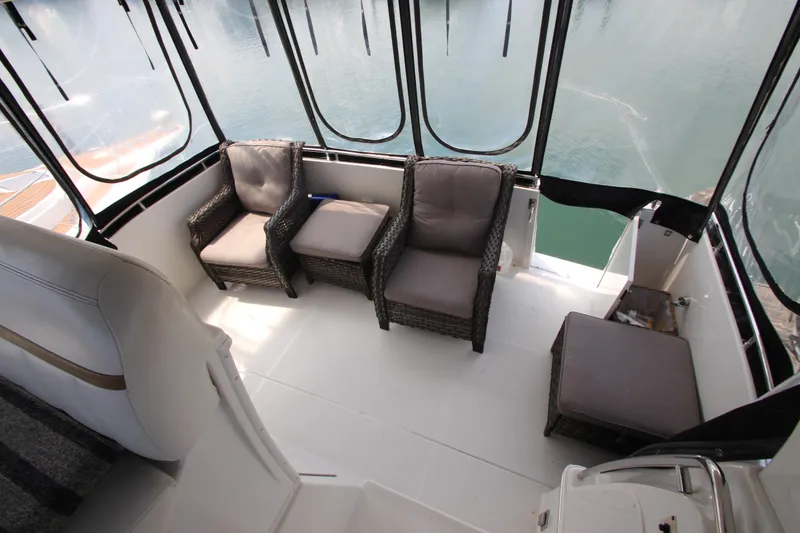 Slide: The Image of Interior of 2002 Carver 366 Motor Yacht with comfortable seating and panoramic windows. - 16