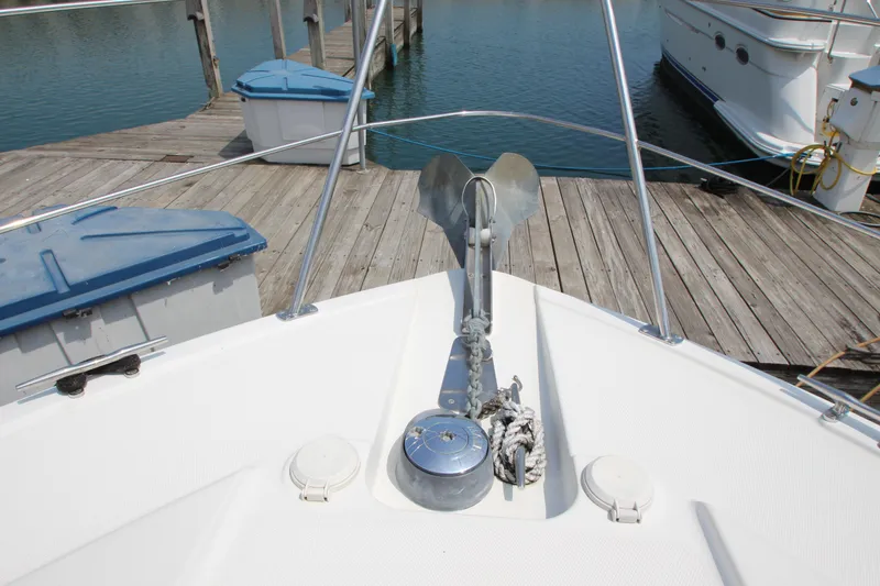 Slide: The Image of Bow of 2002 Carver 366 Motor Yacht with anchor and dock view. - 21